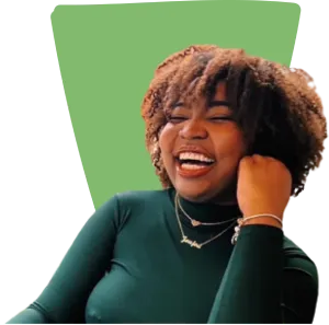 A smiling woman with curly hair, radiating joy and positivity.